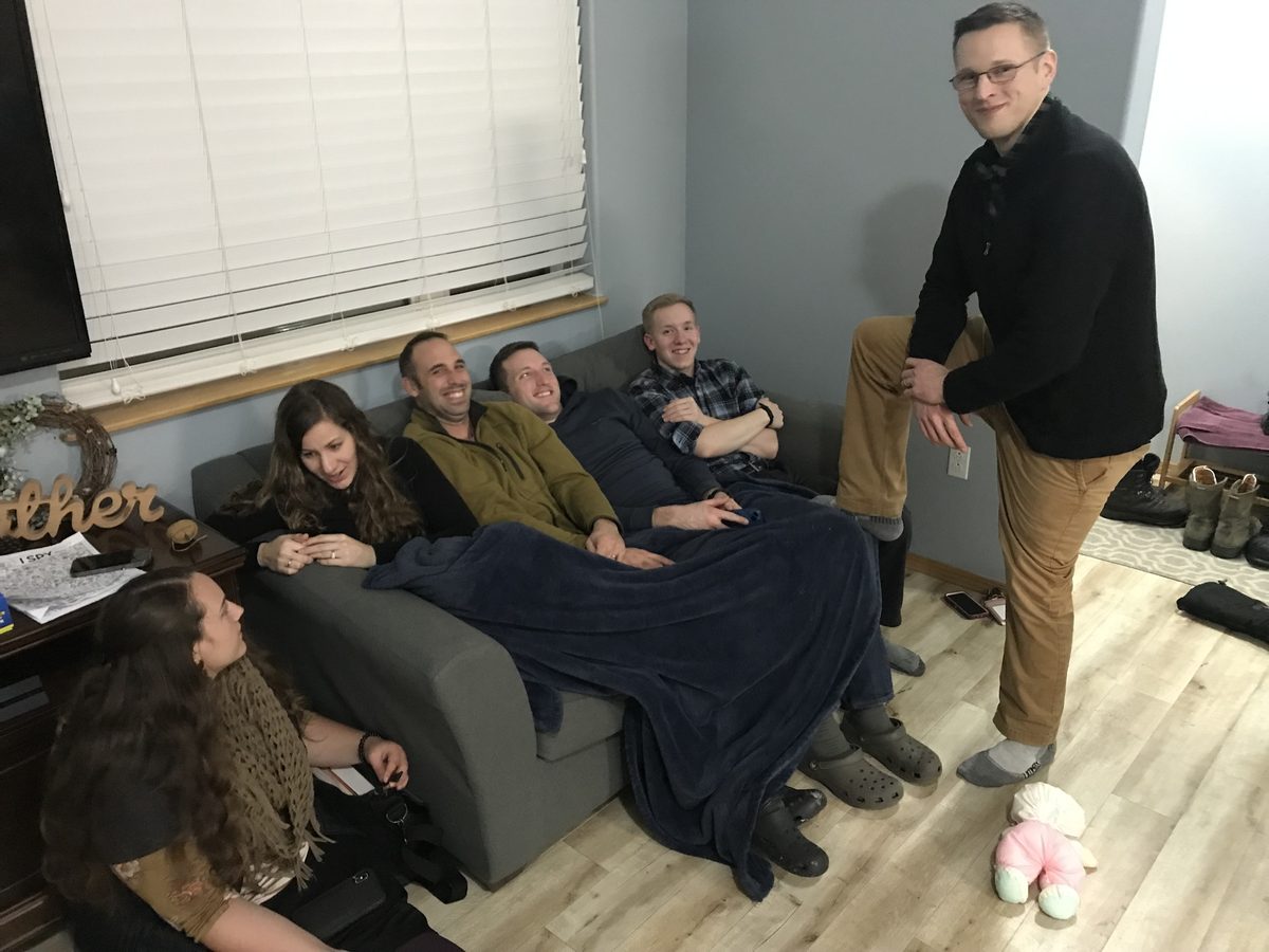 Church members gathered in a home
